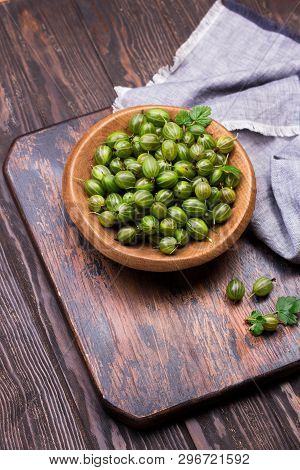 Sweet Fresh Gooseberry Berry In A Bowl On Dark Background. Top View