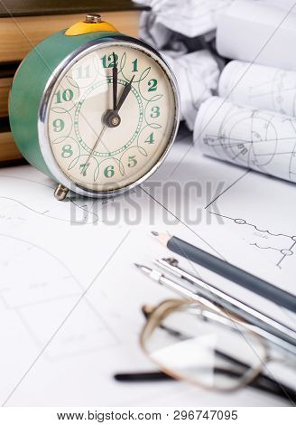 Books On Architecture, A Few Crumpled Drawings, Glasses On The Table In The Architect