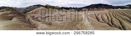 Panoramic View Of An Arid Landscape Created By The Mud Volcanoes In Berca, Romania. A Mud Volcano Or