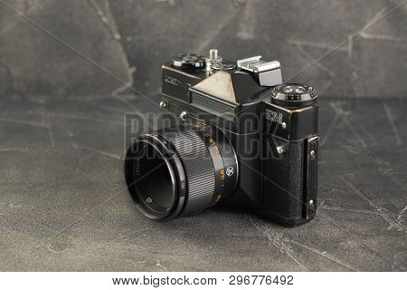 Moscow, Russia, April 22, 2019. The Old Soviet 35 Mm Slr Film Camera Zenit Em, Released 1980 On Gray