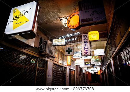 Athens, Greece - 26 Mar 2016: Multiple Busines Signs Totmes And Firms Logotypes On The Passage In Ce