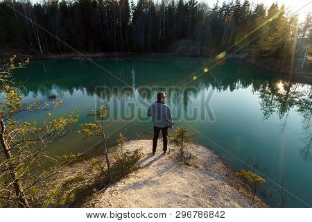 Young Man Take Travel Photos - Beautiful Turquoise Lake In Latvia - Meditirenian Style Colors In Bal