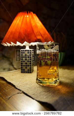 Sabile, Latvia - April 21, 2019: Glass Of Uzavas Light Beer At A Krogs Restaurant