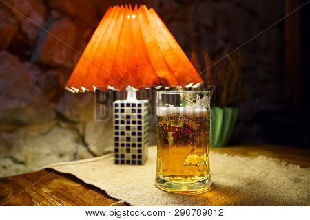 Sabile, Latvia - April 21, 2019: Glass Of Uzavas Light Beer At A Krogs Restaurant