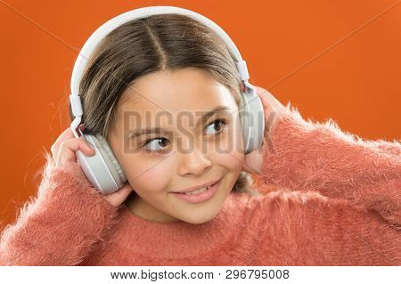 Girl Cute Little Child Wear Headphones Listen Music. Kid Listen Music Orange Background. Recommended