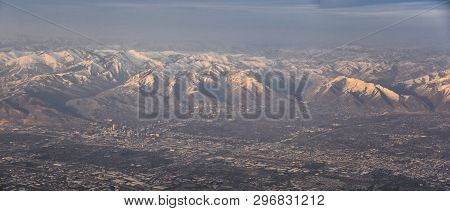 Aerial View From Airplane Of The Wasatch Front Rocky Mountain Range With Snow Capped Peaks In Winter