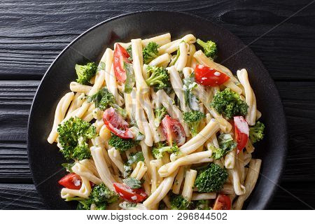 Dietary Pasta Casarecce With Vegetables Dressed With Creamy Cheese Sauce Close-up On A Plate. Horizo