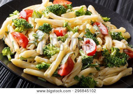 Warm Salad Of Pasta Casarecce With Broccoli, Garlic And Tomatoes Seasoned With Creamy Cheese Sauce C