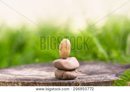 Stones Stacked Meditation. Close Up Of Stack Of Stone On Wooden Table For Background Or Wallpaper.