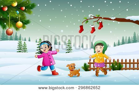 Happy Kids Wearing A Winter Chlotes Playing On The Snow In Christmas Day