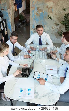 Top View Of Business People Working Together While Spending Time In The Office.