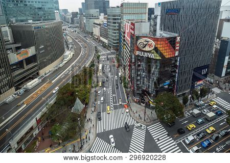 Tokyo, Japan - October 2017 : Top View Of Undefined Japanese People Crowd Are Walking To Crosses The