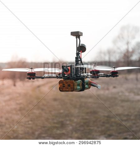 A Small Fpv Racing Drone Is Ready To Fly And Hovered Above The Ground Before The Race. Self-made Fly