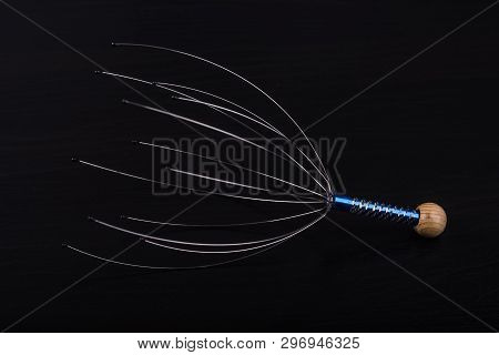 Device For Head Massage. Black Background. Orgasm. Relaxation.