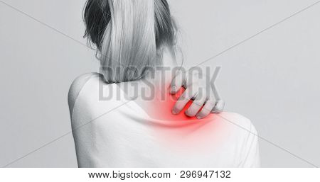 Woman With Symptoms Of Itchy Urticaria, Scratching Her Red Neck, Back View