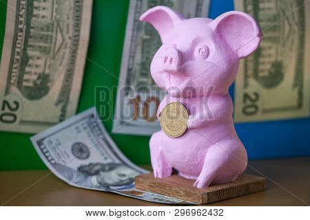 Pink Pig Holding Hryvna Coin. Pig With Hryvna Coin Against The Background Us Dollars Background. Uah