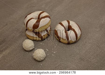 Sweet Cream Cake On A Gray Background And Round Rafaelo Sweets