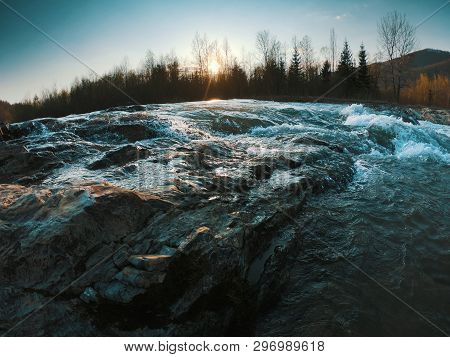 Landscape With Mountains Trees And A River In Front