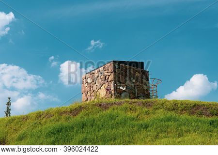 Cheonan,south Korea-september 2020: Stone Chimney With A Grass Field
