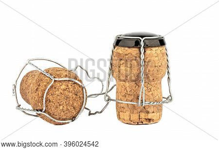 Two Corks Of Champagne With Muselet Isolated On White Background. Copy Space. Close Up.