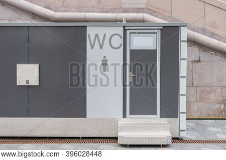 Modern Public Toilet Exterior Outdoor. Modern Toilet Metal Building, Outdoor, Day Time. Front View O