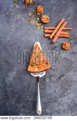 Pumpkin Pie With Lemon Zest, Pumpkin Seeds, Cinnamon, Fragrant And On A Dark Background. Healthyfood