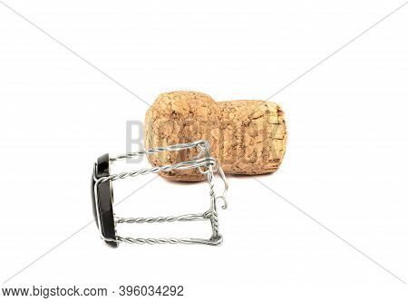 Champagne Cork And Muselet Separately On A White Background. Champagne Cork Parallel To The Muselet.