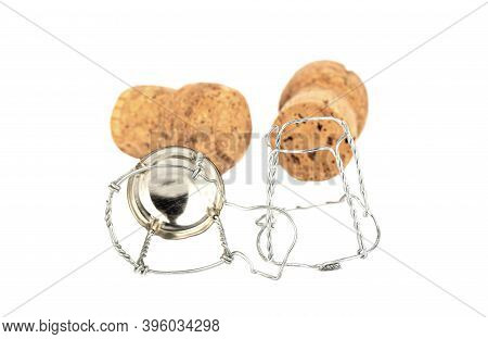 Selective Focus Of Two Champagne Corks And A Muselet Separately On A White Background. Soft Focus, C