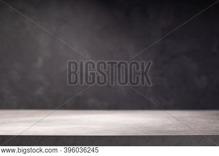 wooden table or tabletop near wall background, front low angle view