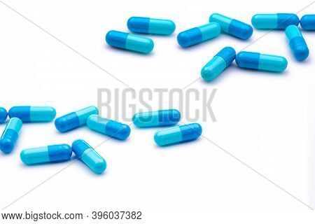 Blue Capsule Pills On White Background. Pharmaceutical Industry. Pharmacy Or Drugstore Products. Hea