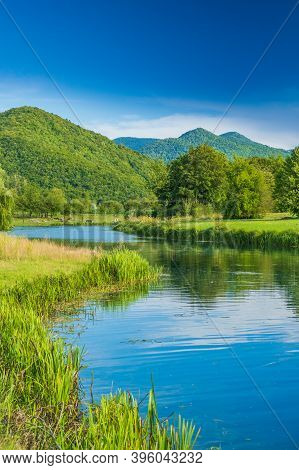Gacka River Between Green Fields, Summer View, Lika Region Of Croatia, Beautiful Green Landscape
