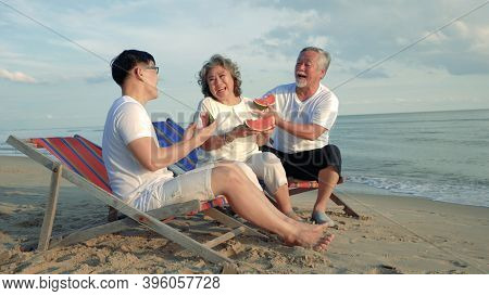 Happiness Asian Family Son And Couple Senior Elderly Retirement Resting Eating Watermalon Fruit On T