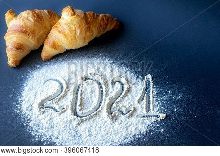 2021 New Year Numbers In The Background Two Croissants On A Dark Gray Background