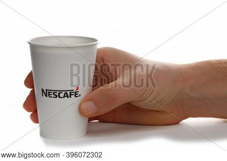 Lviv, Ukraine - November 20, 2020: Nescafe Coffee In A Paper Cup In Hand