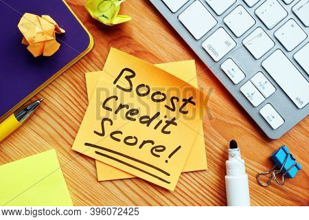 Boost Credit Score Mark On The Orange Piece Of Paper.