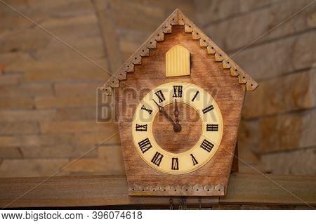 Old Clock On A Wooden Light Wall. Vintage Clock. Cuckoo Clock. Copy-space.