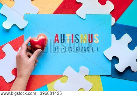 German Text Means Autism Is Not A Disease. Jigsaw Puzzle Element On Layered Felt Pieces, Top View.