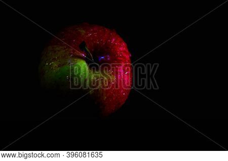 Apple With Waterdops On Dark Black Backgroud