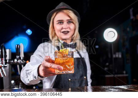 Girl Barman Concocts A Cocktail In The Brasserie