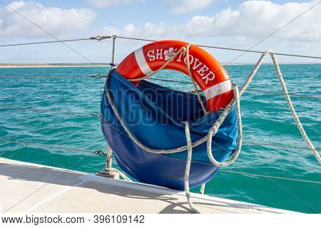 Denham, Western Australia - July 5, 2018: Orange Rescue Wheel On A Catamaran Used For Sea World Watc