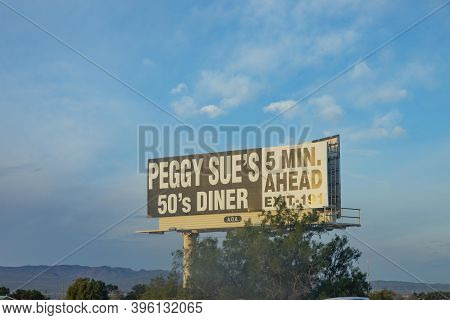Yermo, Usa - Mar 11, 2019: Advertising For Peggs Sues Diner In 5 Miles, Exit 191.