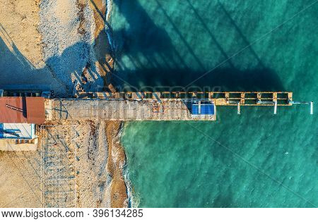Aerial Top View Of Old Concrete Pier, Black Sea Coast, View From Above.