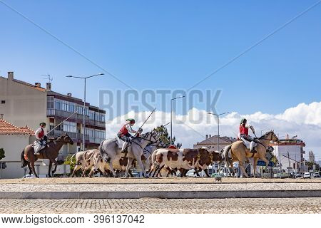 Samora Correia, Portugal - March 16, 2020: Roundabout At  Samora Correia With Riders, Horses And Cow