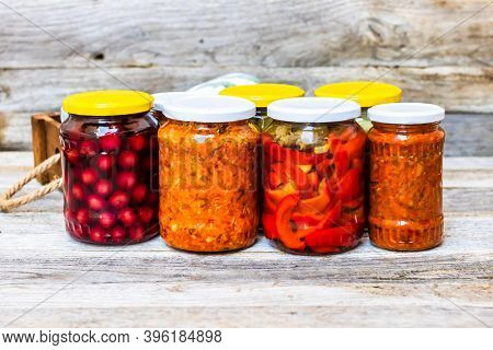 Jars With Variety Of Canned Vegetables And Fruits, Jars With Zacusca. Preserved Food Concept In A Ru