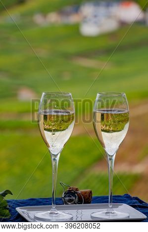 Tasting Of French Sparkling White Wine With Bubbles Champagne On Outdoor Terrace With View On Grand