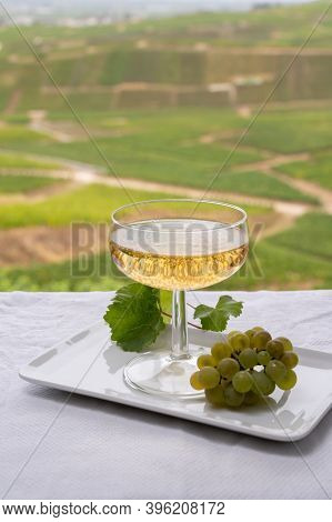 Tasting Of French Sparkling White Wine With Bubbles Champagne On Outdoor Terrace With View On Grand