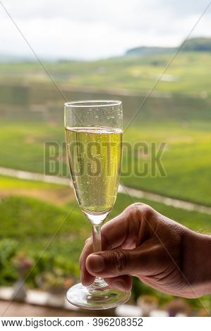 Tasting Of French Sparkling White Wine With Bubbles Champagne On Outdoor Terrace With View On Grand