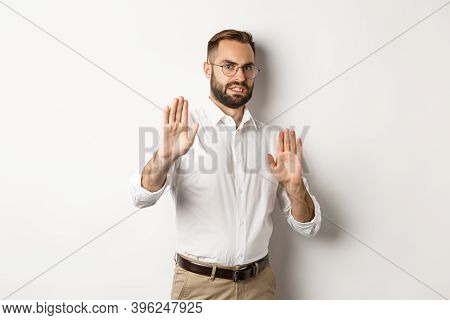Displeased Man Rejecting Something Disturbing, Showing Stop Sign And Declining, Cringe From Aversion