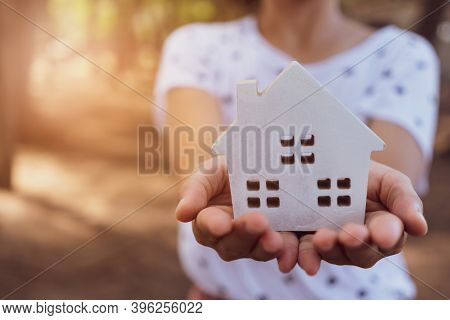Copyspace Model Of A Little House That Woman Holds It Background. Deam Life Have Own House Property 
