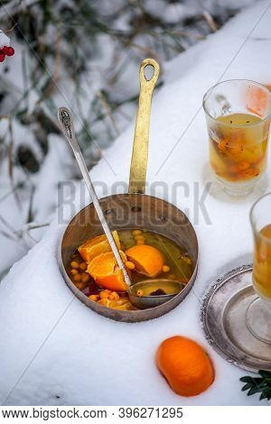 Mulled Wine With Sea Buckthorn And Mandrins In The Winter Garden Selective Focus